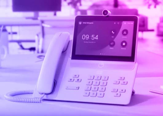 Cisco Webex Calling desk phone with touchscreen showing call, transfer, and voicemail options